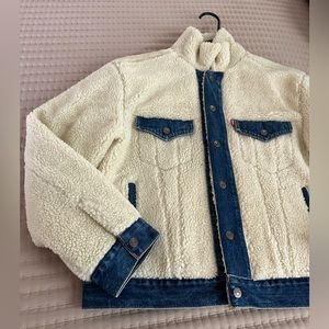 The Levi Ex-Boyfriend Pieced off White Multi Sherling Trucker Jacket.